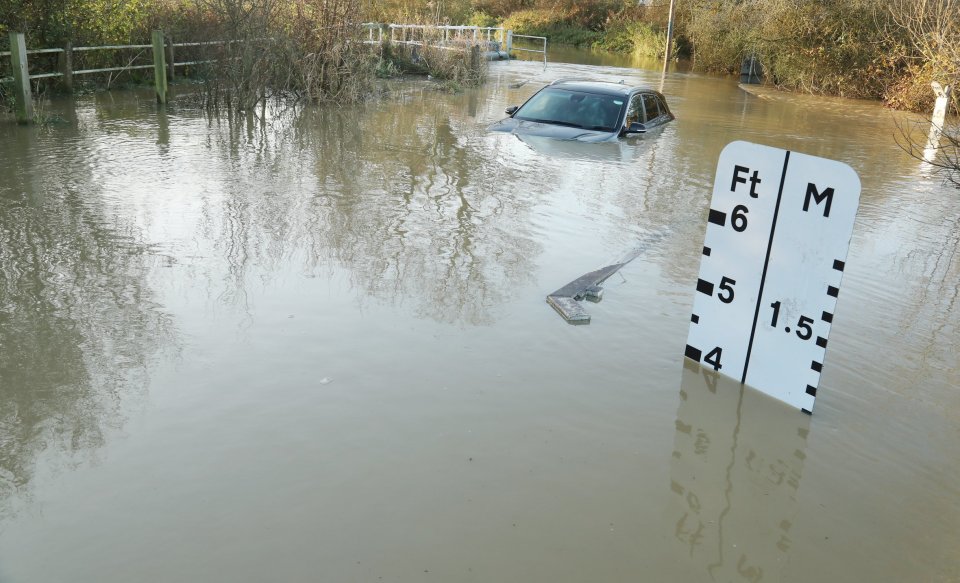 A driver got stuck in 4ft floods in Essex yesterday