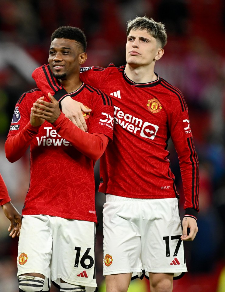 Manchester United players Mainoo, Diallo, and Garnacho applaud fans after a match.