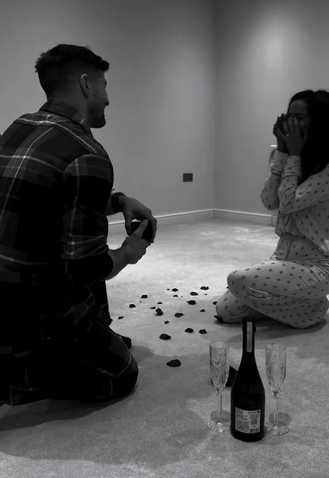 A man proposing to a woman.