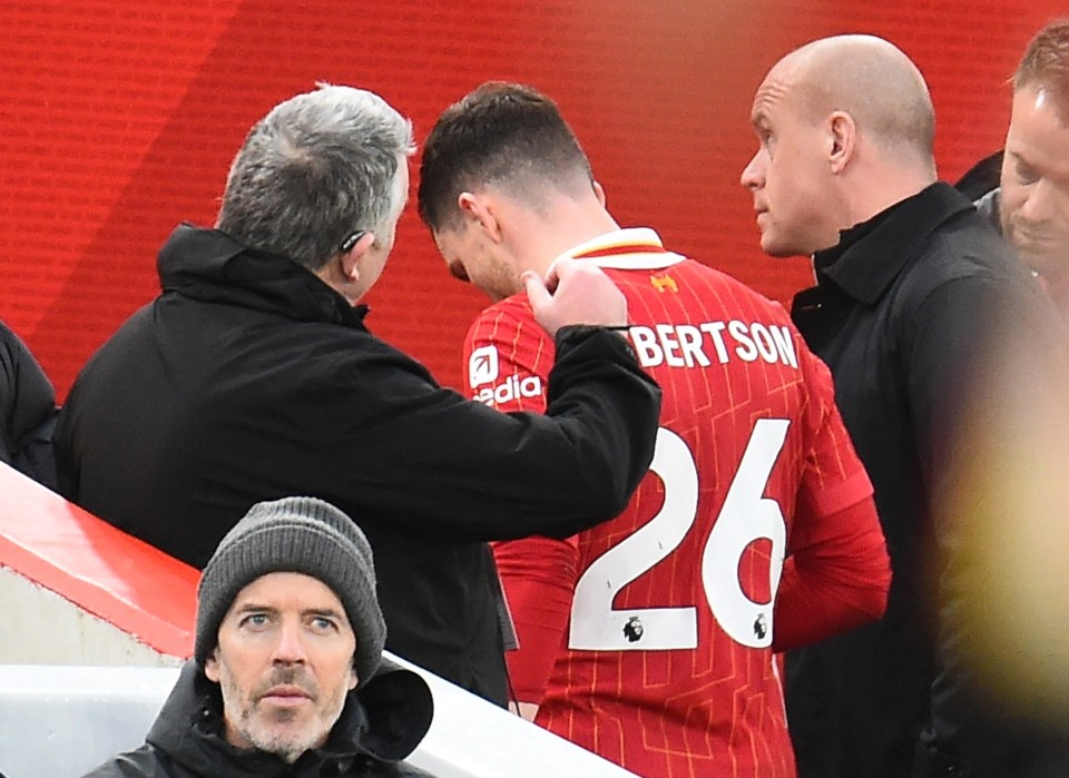Liverpool's Andy Robertson leaves the field after a red card.