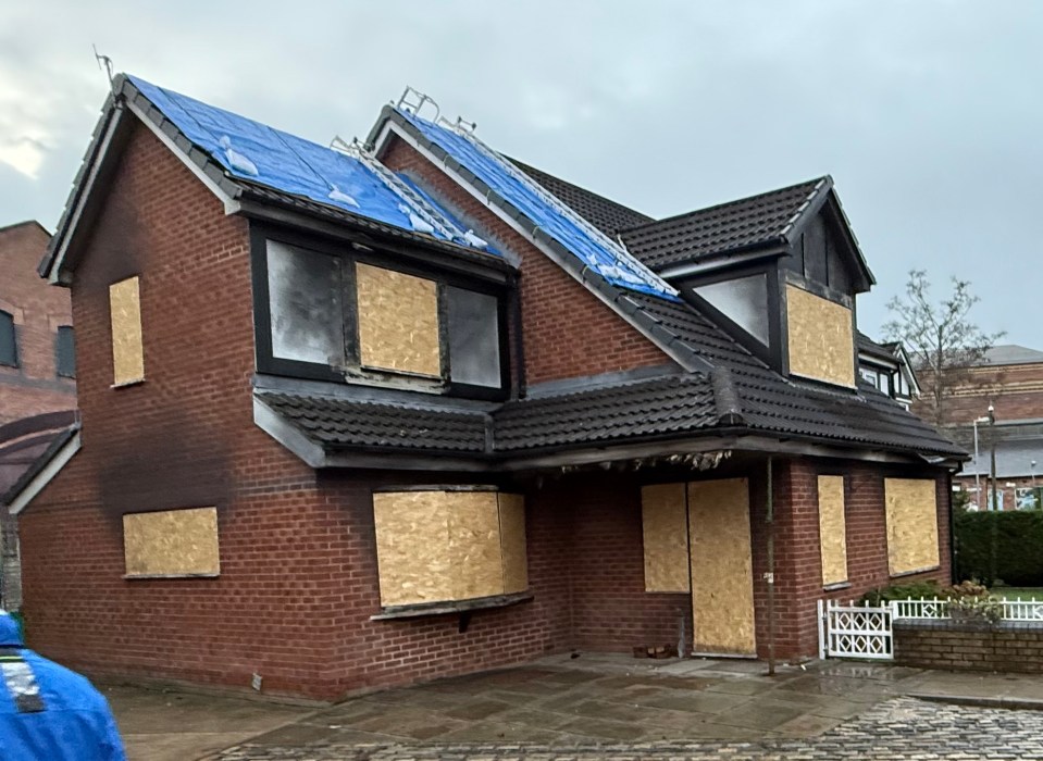 Boarded-up house after a fire.