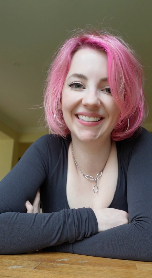 Alice Lovegood, a sex educator, smiling for a portrait.
