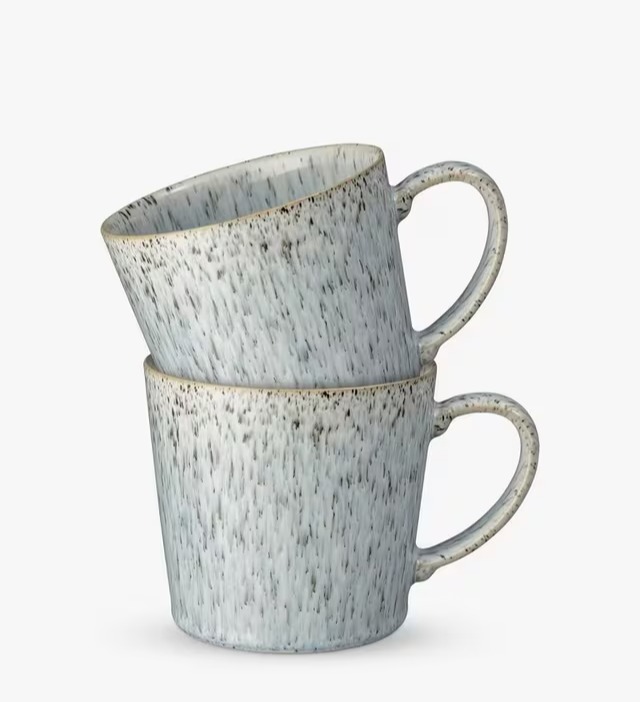 Two speckled gray mugs stacked.