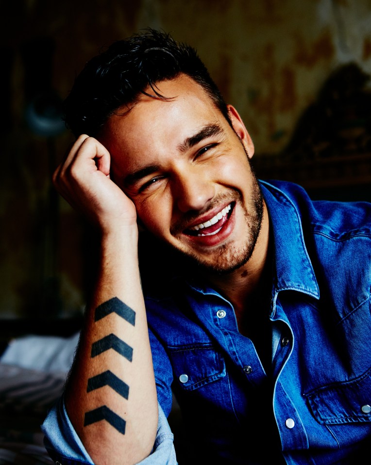 Liam Payne smiling for Attitude magazine.