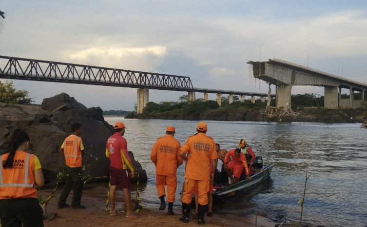 Firefighters rescue people from a collapsed bridge.