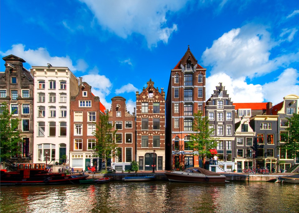 Amsterdam canal houses and boats.