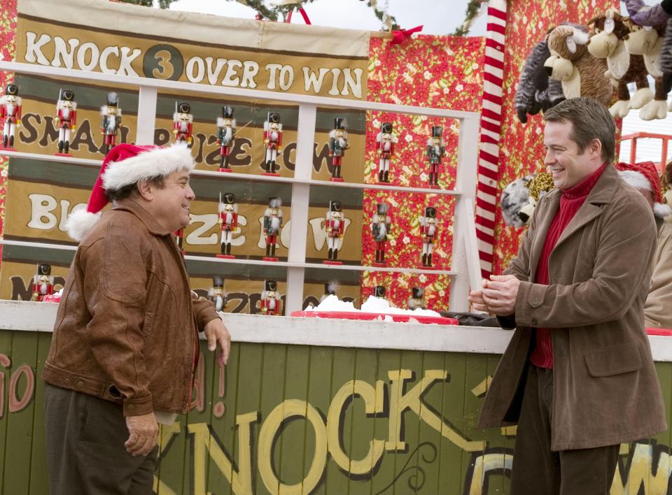 Matthew Broderick and Danny DeVito in a scene from the Christmas movie *Deck the Halls*.