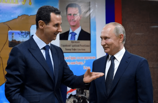 Bashar al-Assad and Vladimir Putin speaking.