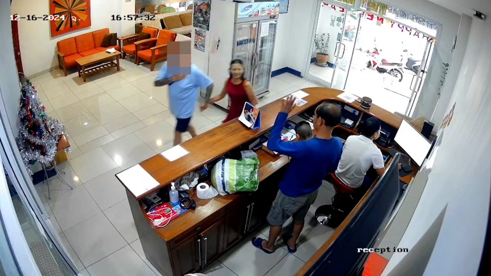 CCTV footage of a man and woman entering a hotel.