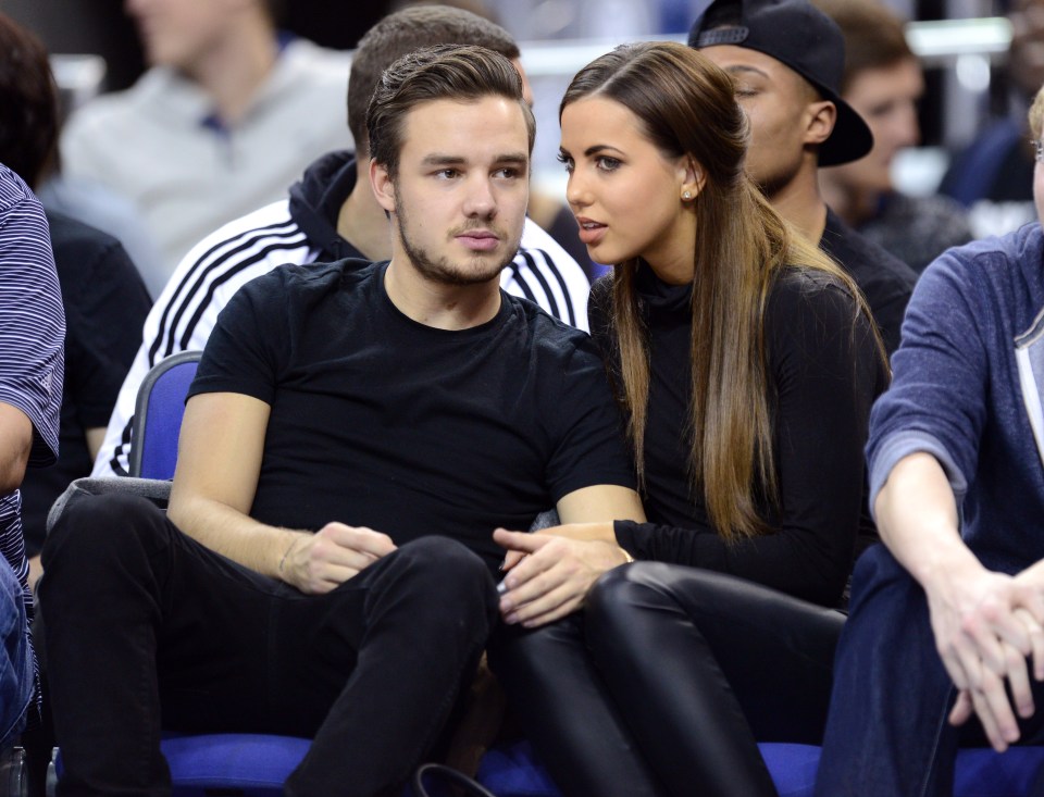 Liam Payne and Sophia Smith at an NBA basketball game.