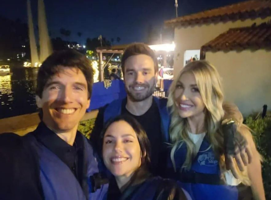 Group photo of Liam Payne's friend Rogelio Nores with three other people at night.