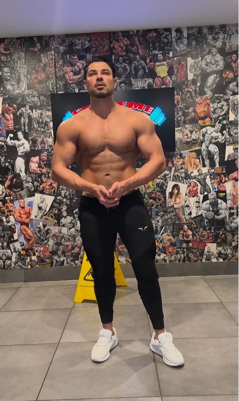 Anton Danyluk, Love Island star, in a gym, shirtless, showing off his physique.