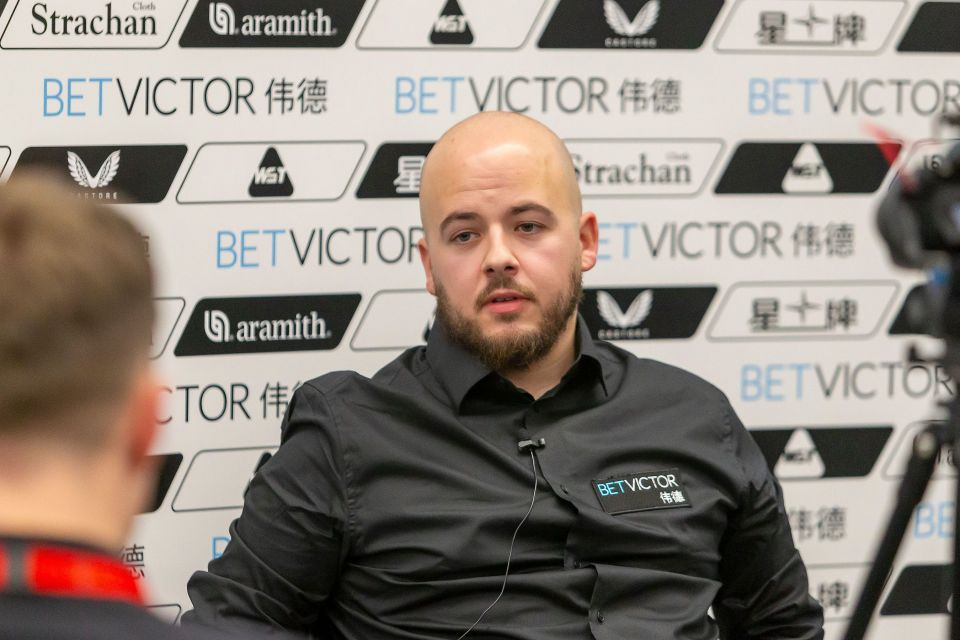 Luca Brecel speaks to the media.