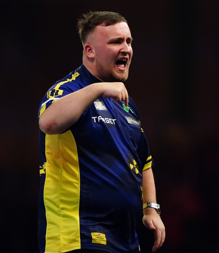 A darts player giving a thumbs-up.