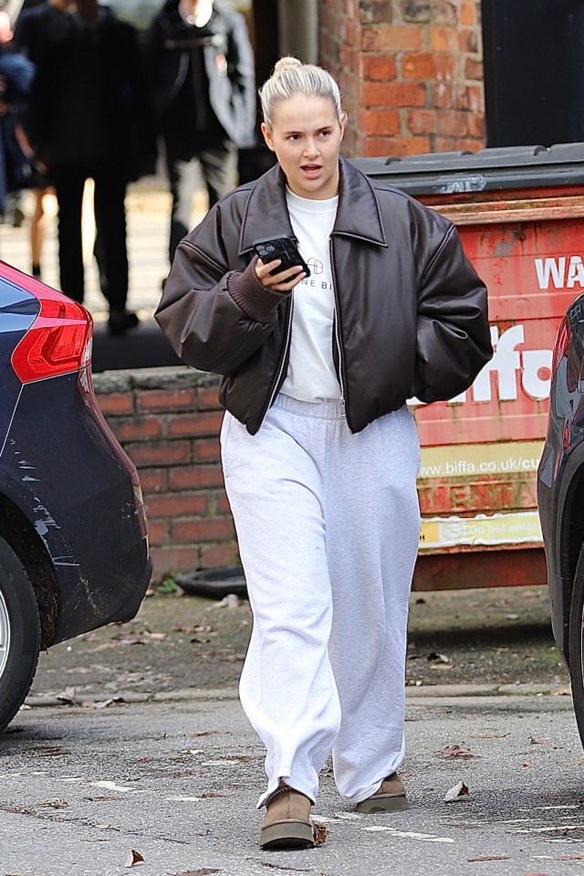 Molly-Mae Hague leaving an office building after Tommy Fury's TV interview.
