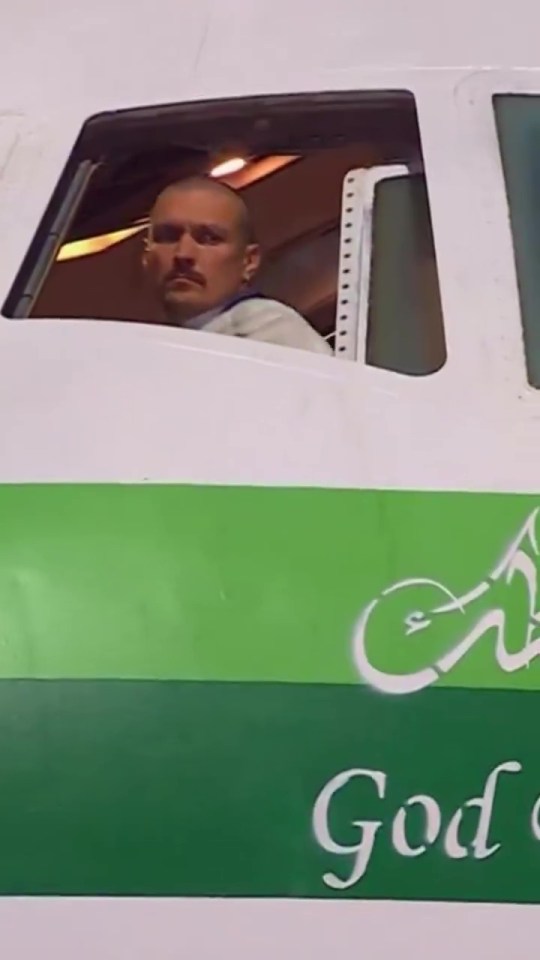 Oleksandr Usyk in an airplane cockpit.