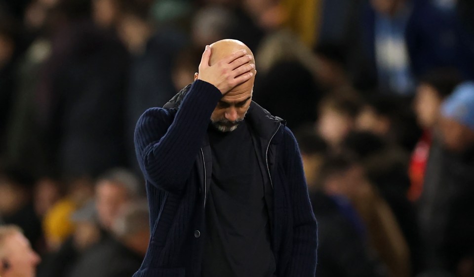 Pep Guardiola, Manchester City manager, looking dejected.