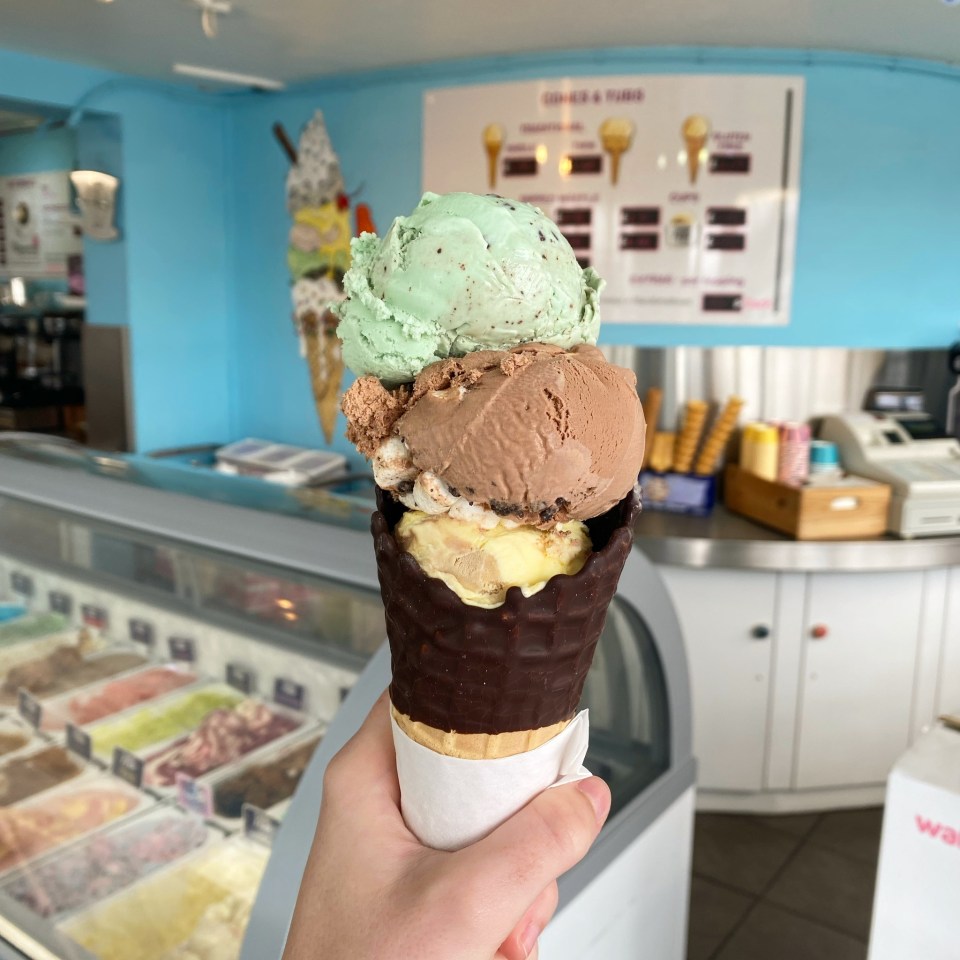 Ice cream cone with mint chocolate chip, chocolate marshmallow, and vanilla ice cream at Pilgrim's ice cream shop in Plymouth.