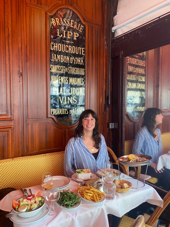 Woman dining at Brasserie Lipp in Paris.