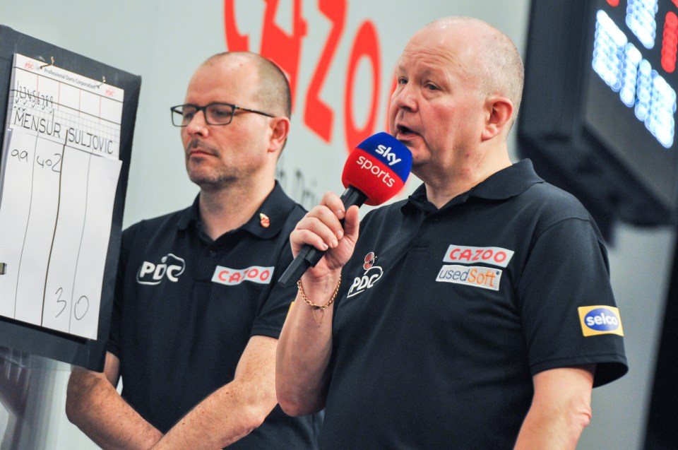 Referee George Noble at a darts match.