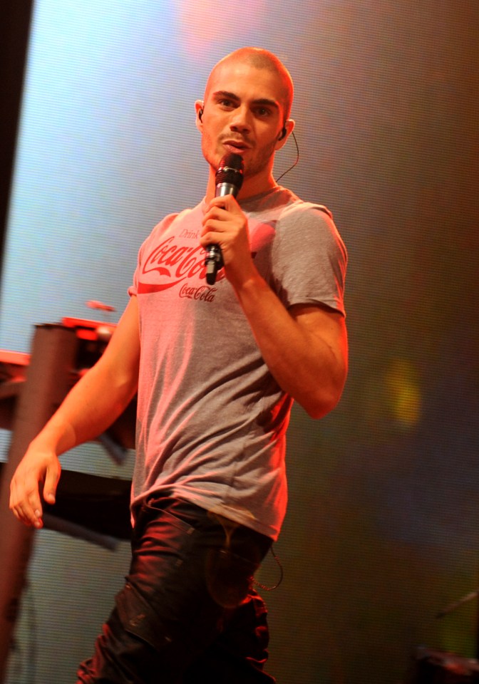Max George of The Wanted performing on stage.