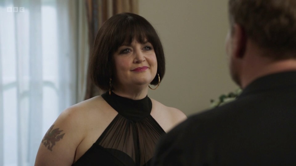 Nessa from Gavin & Stacey in a black halter dress.