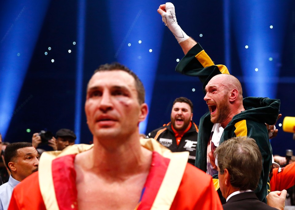 Tyson Fury celebrates his victory over Wladimir Klitschko in a boxing match.
