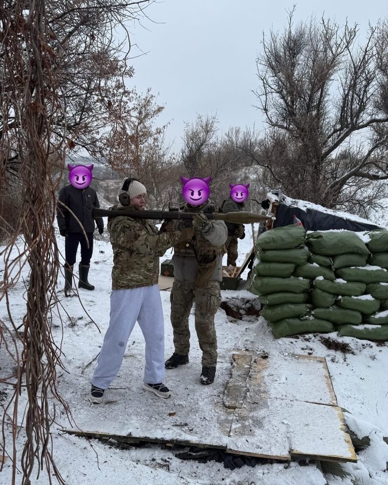 Elina Svitolina aims a rocket launcher in the snow