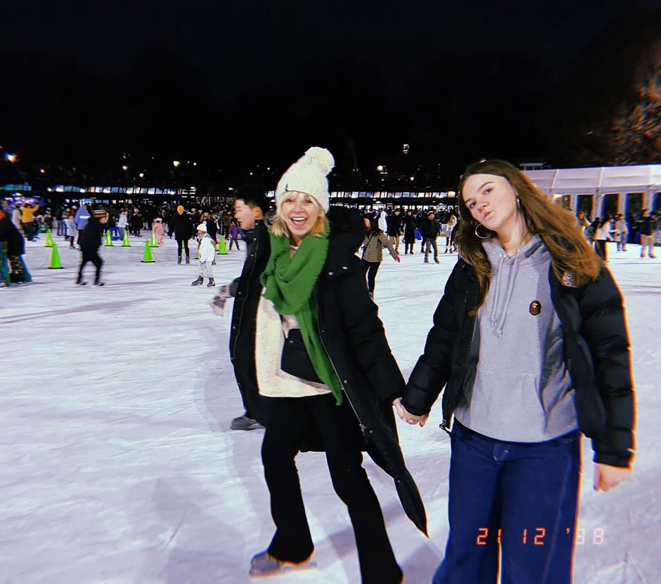 Zoe Ball and her daughter ice skating at night.