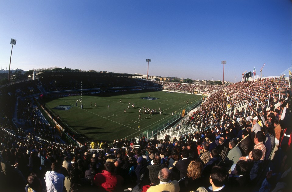 A rugby match in a crowded stadium.