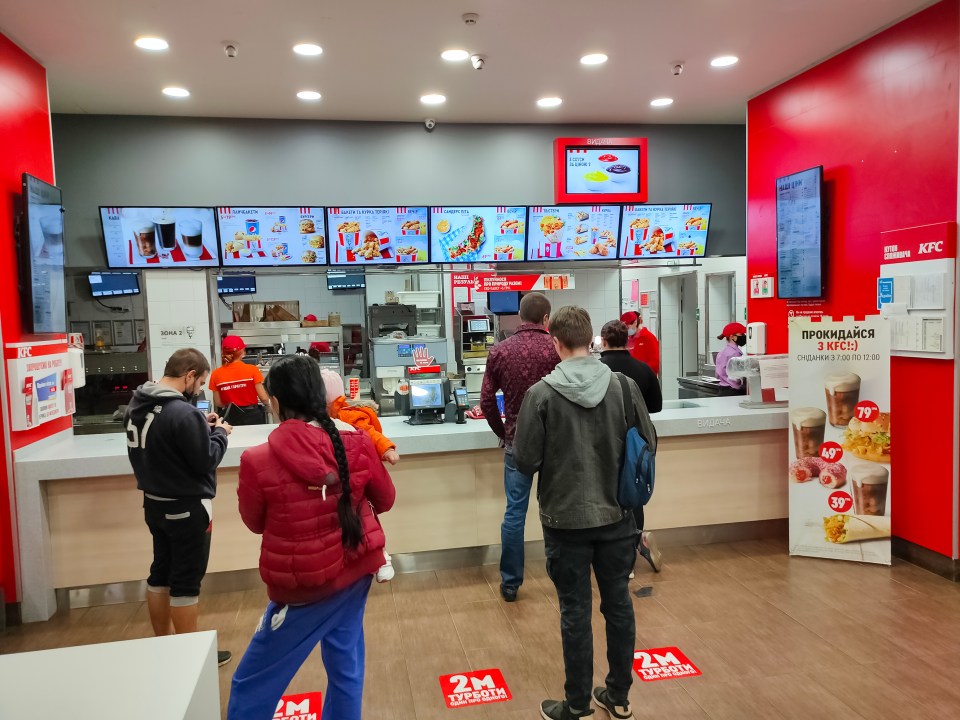 Customers in a KFC maintaining social distancing.