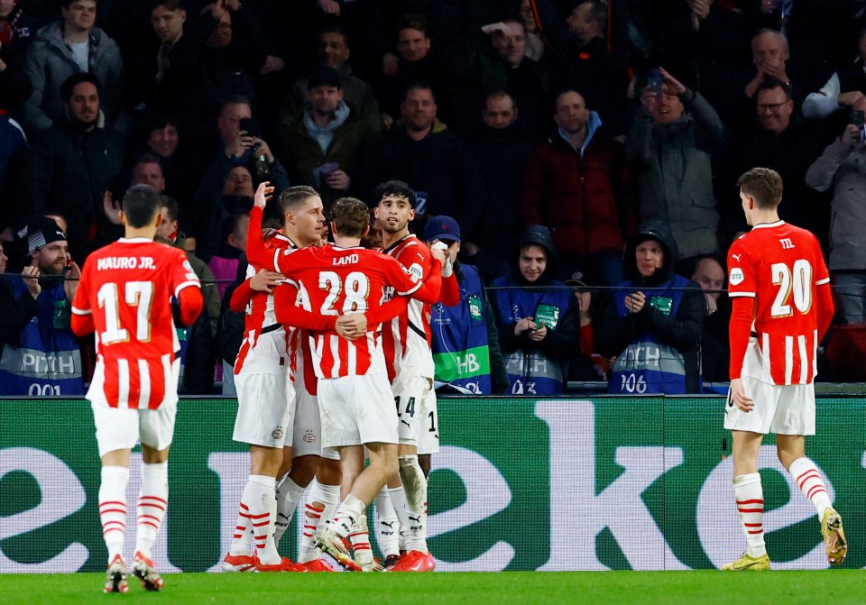 PSV Eindhoven players celebrating a goal.