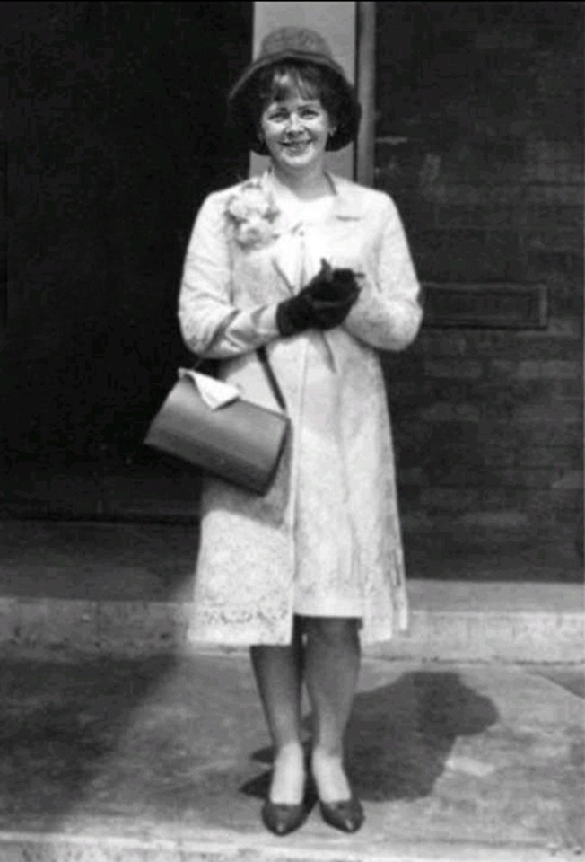 Black and white photo of Mary McLaughlin at a wedding.