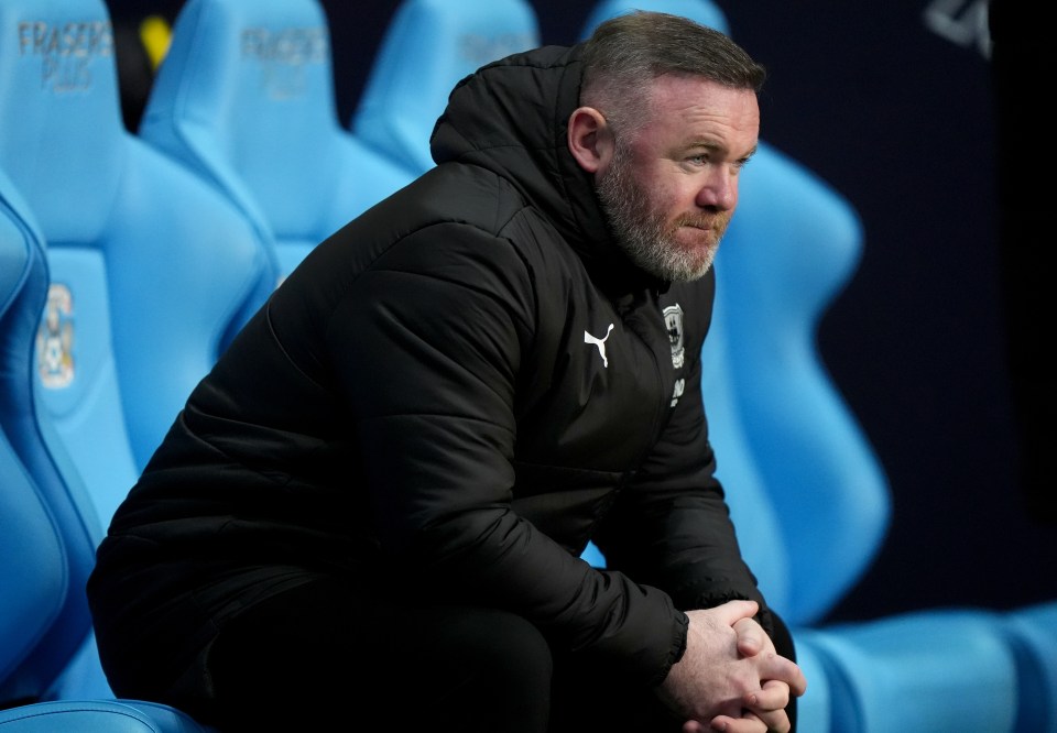 Wayne Rooney sitting on a bench after leaving Plymouth.