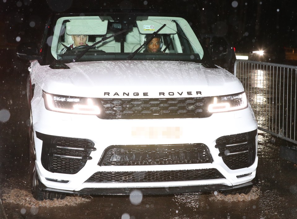 Alejandro Garnacho and Amad Diallo in a Range Rover after a late-night drive.