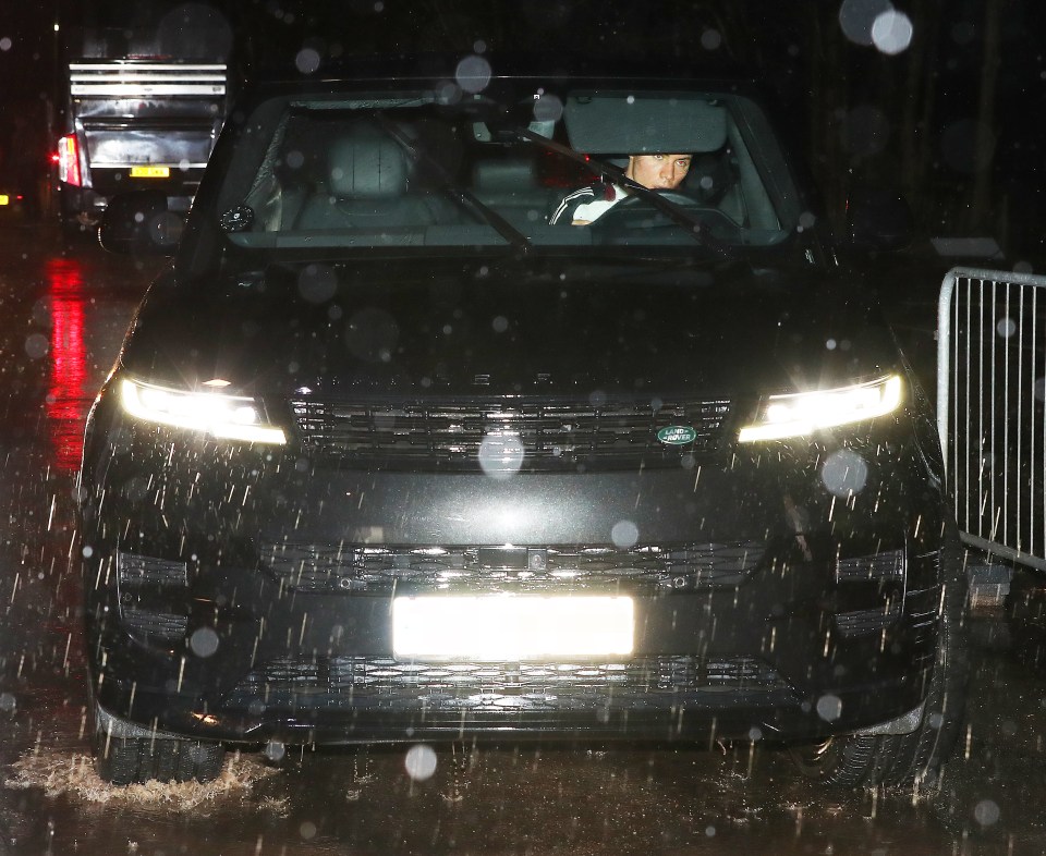 Rasmus Hojlund driving in the rain after Manchester United's game.