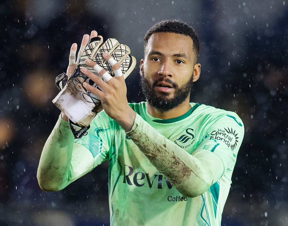 Lawrence Vigouroux of Swansea City AFC applauds fans.
