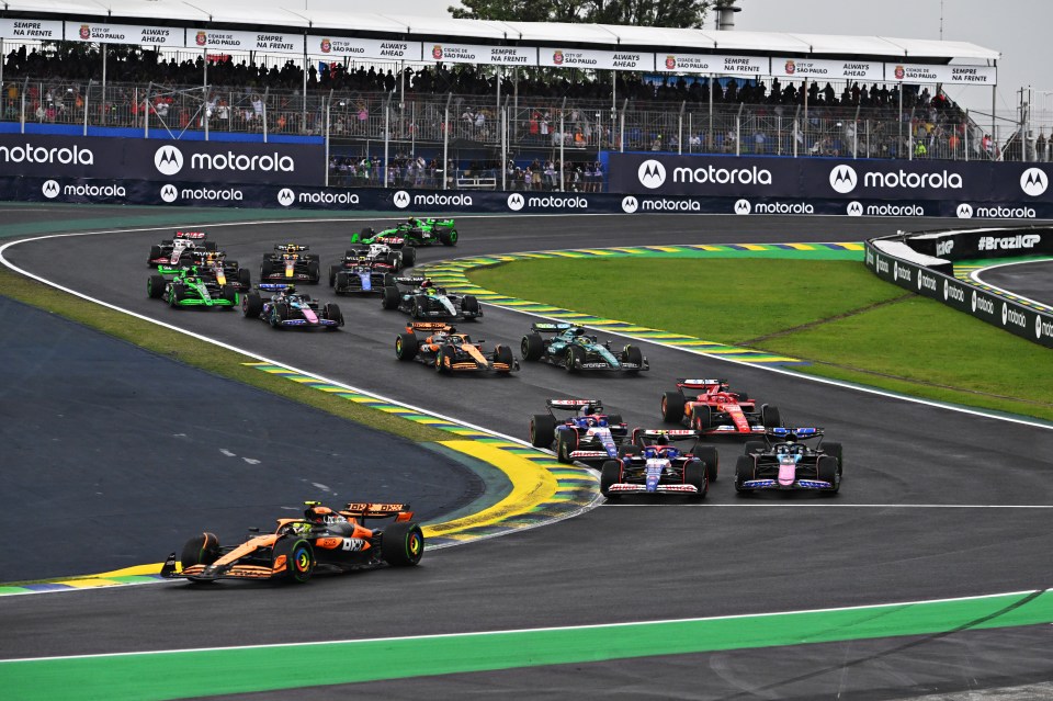 Formula 1 cars racing on a track.