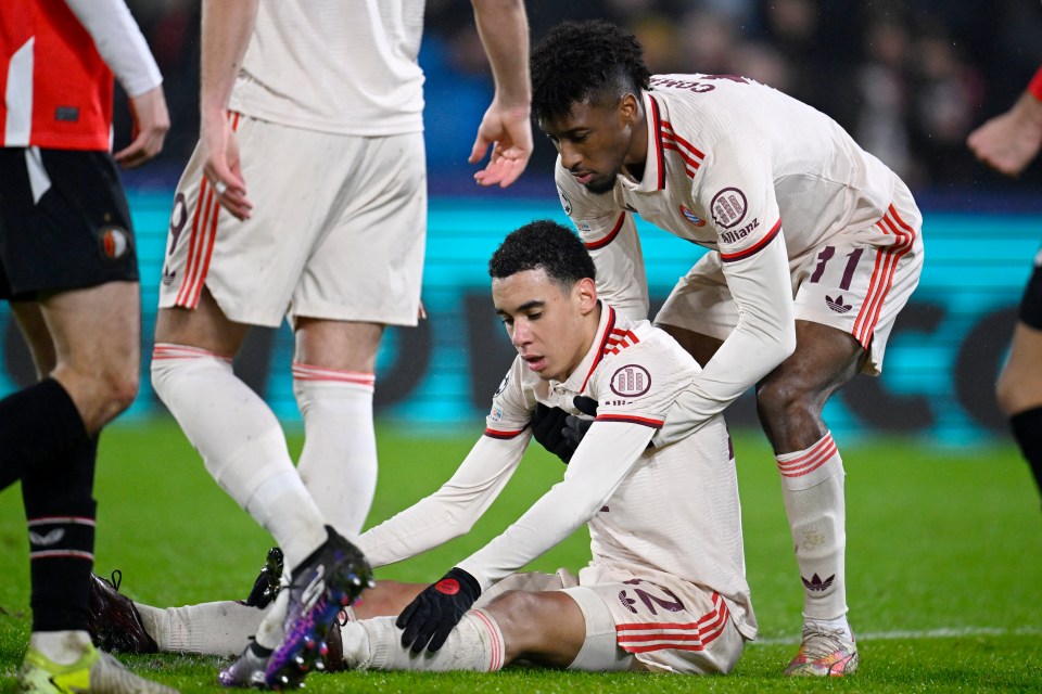 Jamal Musiala of Bayern Munich comforted by a teammate after missing a goal.