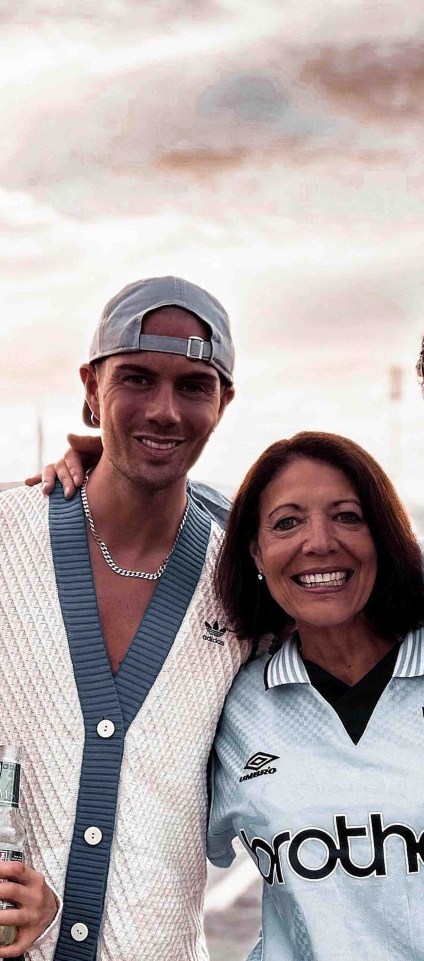 A group photo of a mother and her three children.