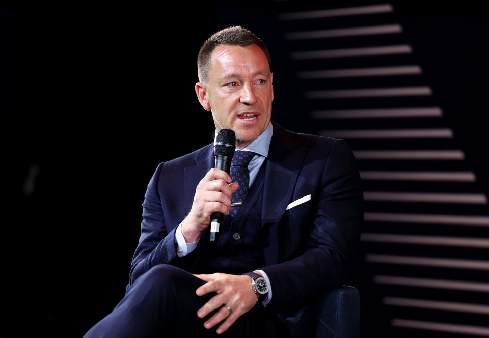 John Terry speaking at an event.