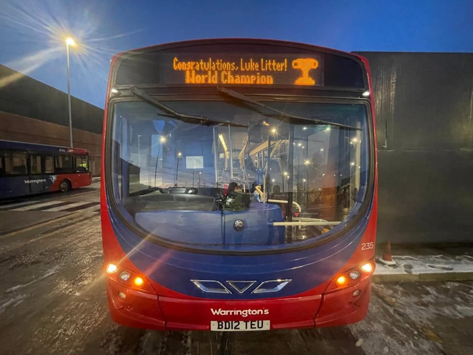Bus displaying "Congratulations, Luke Litter! World Champion".