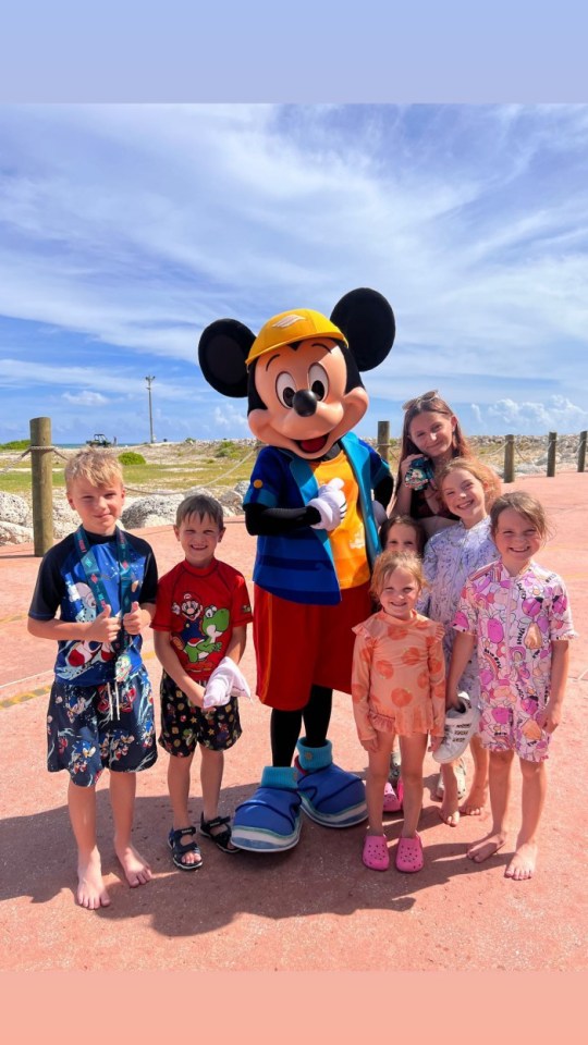 The Radford family with Mickey Mouse on vacation.
