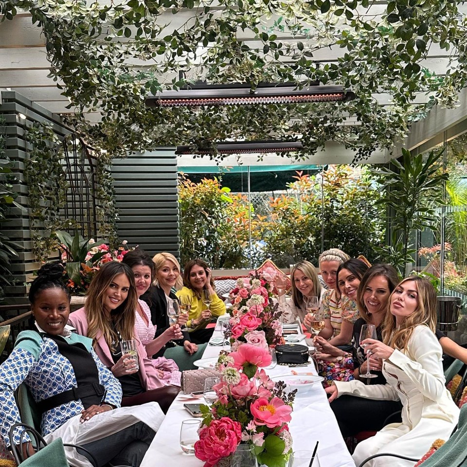 Abbey Clancy poses with HUGE bottle of wine alongside Holly Willoughby and Christine Lampard,