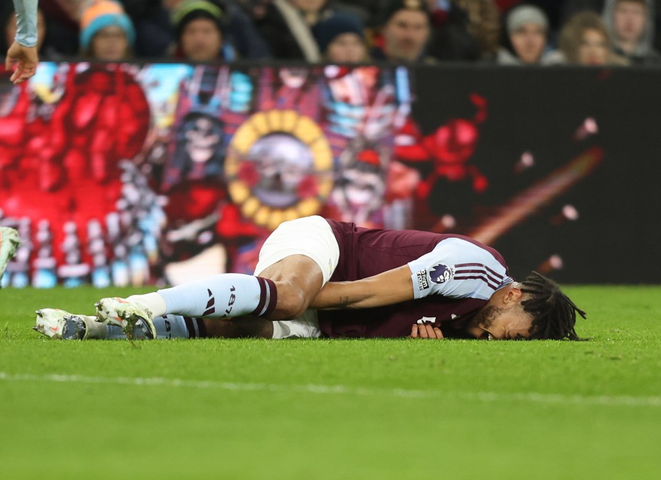 Aston Villa's Tyrone Mings injured on the field.