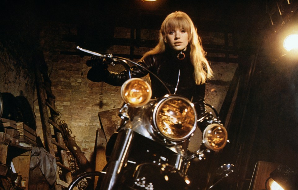 Marianne Faithfull on a motorcycle in a scene from *The Girl on a Motorcycle*.