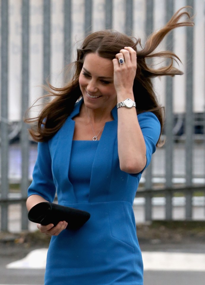 Catherine, Duchess of Cambridge, wearing a blue dress and Cartier watch.
