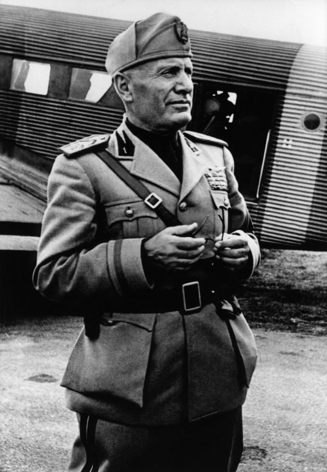 Black and white photo of Benito Mussolini in uniform.