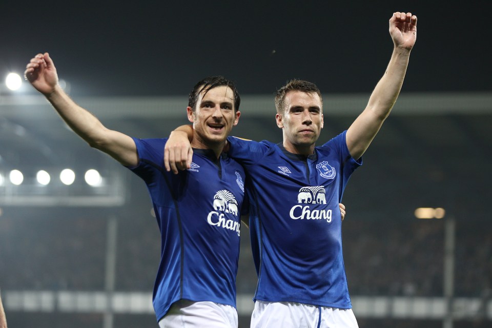 Two Everton soccer players celebrating a goal.