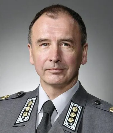 Portrait of a man in military uniform.
